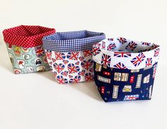 four small fabric baskets with british flags on them, all in different colors and designs