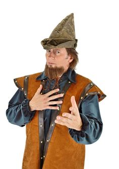 a man wearing a brown vest and hat with his hands on his chest while standing in front of a white background