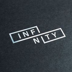 the word infjty is printed on a black surface with white letters and lines