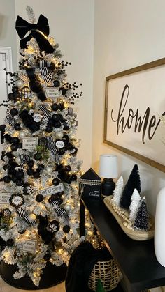 a decorated christmas tree with black and white ornaments