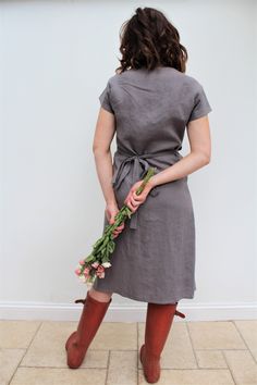 Our love of linen continues with this lovely linen wrap dress. Made in light weight Grey linen fabric, which has been prewashed giving a soft feel. With its flattering sleeves and the all essential Voy side pocket. This will quickly become one of your go-to dresses, and will find it really useful both for work and play! A capsule wardrobe must for the coming season! Length is below knee to mid-calf. Handmade in our studio to order Easy care as you can hand/machine wash. Linen used is Oeko Tex ce Linen Wrap Dress, Gray Linen, Dresses Uk, Side Pocket, Find It, Mid Calf, Capsule Wardrobe, Linen Fabric, Our Love