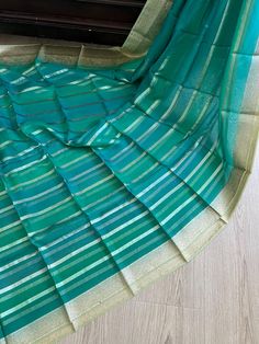 This Trendy Beautiful Pure Organza Silk Saree has Fine Woven Zari Work on Body and  Zari Woven Border!! Very Gorgeous, Light weight, Easy to Drape and Fall Well!! Comes with an unstitched matching blouse piece. Material: Pure Organza Silk Fall & Pico ✅  ** Jewellery is not included! Disclaimer: slightly color variations may be possible due to light effects! Green Dupatta With Unstitched Blouse For Eid, Green Anarkali Set With Self Design For Celebration, Green Banarasi Silk Party Sets, Green Self Design Tissue Silk Dupatta, Green Unstitched Blouse Set For Celebration, Green Georgette Salwar Kameez With Unstitched Blouse, Party Green Dupatta With Zari Weaving, Green Celebration Sets With Unstitched Blouse, Green Silk Lehenga For Celebration