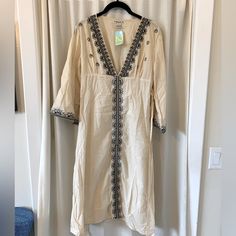 This Gorgeous Tunic Can Be Yours Just In Time For Summer. Ivory With Black Embroidery, Slightly Flared Sleeves, And Tie At The Waist. Embroidered Cream Kaftan For Summer, Cream Embroidered Kaftan For Summer, Forever 21 V-neck Beach Maxi Dress, Spring Vacation Cream Kaftan, Cream Kaftan For Spring Vacation, V-neck Beach Dress By Forever 21, Forever 21 V-neck Beach Dress, Forever 21 Bohemian Dress For Vacation, Bohemian Vacation Dress By Forever 21