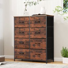 a wooden dresser sitting next to a window