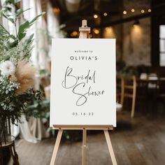 an easel with a sign that reads, welcome to ollivia's bridal season