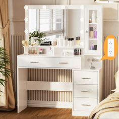 a white vanity with lights on it and a mirror in the corner next to a bed