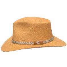 Authentic Aficionado is a safari-style fedora with a reinforced hand-blocked teardrop crown that features a wide fixed brim, padded twill sweatband, and a rustic braided rope hatband. The brim is fixed down in the front and back while containing a wire to hold its shape. This item is a genuine Panama Hat handwoven in Ecuador. Material: 100% Toquilla Straw Brim: 3" fixedCrown: 4 1/4" teardropHatband: 5/8" braided ropeClimate: Sun Handwoven in Ecuador. Hand-finished in the US. Measurements are app Casual Brown Braided Fedora, Casual Braided Brimmed Panama Hat, Casual Wide Brim Braided Fedora, Casual Braided Hat For Rodeo, Brown Braided Casual Hat Band, Casual Brown Braided Hat Band, Casual Braided Brown Hat Bands, Western Brown Panama Hat For Travel, Western Style Brown Panama Hat For Travel