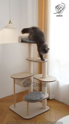 a cat climbing on top of a scratching tower