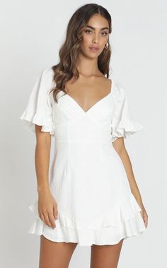 White V-neck Sundress, Fitted Beach Dresses With Flutter Sleeves, Fitted Flutter Sleeve Beach Dresses, White Feminine Dress For Brunch, Feminine White Dress For Brunch, Flirty White Mini Dress For Vacation, White V-neck Mini Dress For Brunch, White V-neck Mini Dress For Spring, White Ruffled Summer Mini Dress