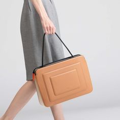 Designed in a silhouette inspired by Art-Deco style, this bag is expertly crafted from Italian calf leather with microsuede lining. Packs a ton of features in a slim, compact space so you can carry your office life in the bag — including a 16” Macbook Pro. It has additional two tight slots on the front that you can fit your notebook, phone or tablet. Crafted from Italian cow leather. Soft coating zippers ensure your laptop won't get scratched. h:28 X w:39.5 X d:7 cm (11 X 15.5 X 2.75 in) Handle Modern Rectangular Laptop Bag With Detachable Handle, Modern Rectangular Laptop Bag With Detachable Strap, Modern Laptop Shoulder Bag With Detachable Handle, Modern Shoulder Laptop Bag With Detachable Handle, Modern Briefcase With Detachable Handle, Modern Laptop Bag With Top Handle, Modern Top Handle Briefcase, Modern Satchel Briefcase With Detachable Handle, Modern Box Bag With Detachable Handle For Work