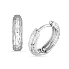 Add a touch of shine and shimmer to any look with these diamond-cut huggie hoop earrings. 14K white gold Each huggie hoop features an allover diamond-cut detailing that catches and reflects light 12.4 x 3.2mm Hinged backs White Gold Tarnish Resistant Huggie Earrings For Anniversary, Diamond Cut White Gold Huggie Earrings, Modern Hypoallergenic White Gold Huggie Earrings, Silver Diamond Cut Huggie Jewelry, Diamond Cut Huggie Earrings, Silver Huggie Jewelry With Diamond Cut, Minimalist Silver Huggie Earrings With Diamond Cut, Hypoallergenic White Gold Huggie Earrings, Fine Jewelry Diamond Cut Small Hoop Huggie Earrings