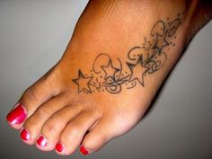 a woman's foot with stars and hearts on the bottom part of her toe