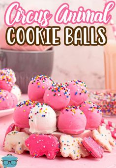 pink and white cake balls with sprinkles on top, in front of the words creme animal cookie balls