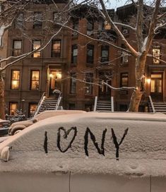 a car covered in snow with the word tony written on it