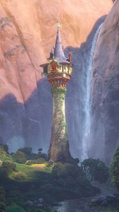 a tall tower with a waterfall in the background