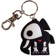 a black and white keychain with a cartoon character on it