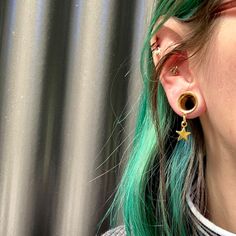 "WELCOME TO PINK ALIEN BABE YOUR ONE STOP SHOP FOR ALL THE CUTEST PLUGS AND ACCESSORIES IN THE GALAXY 🪐⭐️ 🎀This is a listing for A PAIR (two pieces) of Golden Star Light dangle earring internally threaded gauges in your choice of size 👽💕 Sizes available: 2g 6mm, 0g 8mm, 00g 10mm, 1/2\" 12mm, 9/16\" 14mm, 5/8\" 16mm (Message us for information about larger sizes!) 👽💕 Looking for more dangle styles? https://www.etsy.com/shop/pinkalienbabe/?etsrc=sdt&section_id=29688744 🌈💖 Your new plugs wi Gold Star Cartilage Earrings For Pierced Ears, Gold Star Cartilage Earrings, Gold Star Shaped Pierced Cartilage Earrings, Pink Alien, Dangle Gauges, Ear Tunnels, Ear Weights, Star Light, Gauged Earrings