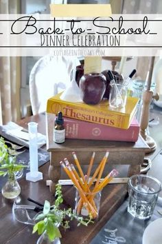 the back to school dinner celebration with books and pencils on top of each other