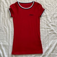 Tommy Hilfiger - T-Shirt - Never Worn Trendy Tommy Hilfiger Cotton T-shirt, Tommy Hilfiger Graphic Tee With Crew Neck, Casual Red Tommy Hilfiger T-shirt, Tommy Hilfiger Cotton T-shirt For Summer, Tommy Hilfiger Stretch Top For Spring, Trendy Tommy Hilfiger Crew Neck Top, Spring Tommy Hilfiger Stretch Top, Spring Stretch Top By Tommy Hilfiger, Tommy Hilfiger Spring Crew Neck Tops