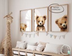 there are three pictures on the wall with teddy bears in them and a giraffe standing next to it