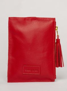 This bag is made from high-quality, super-soft red leather sourced from a premiere hide house in California. The leather is shipped to New York City, where our bags are produced by expert craftsmen and finished with a smooth zipper, leather tassel, and acrylic ring. Just big enough for all your essentials, we designed the Ring Wristlet to be your go-to bag for going out! Whether you’re heading to a cocktail party, a concert, or out on the town, slip it on your wrist so your hands are free for si Luxury Red Pouch For Everyday Use, Modern Red Leather Clutch, Red Leather Wallet With Removable Pouch, Red Leather Clutch Wallet, Red Leather Everyday Clutch, Everyday Red Leather Clutch, Red Leather Pouch For Gift, Red Leather Clutch With Removable Pouch, Red Leather Clutch Pouch