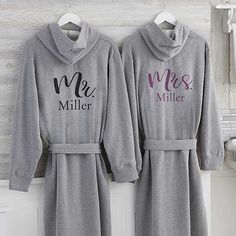 * Personalized with any title and the couple's first or last name in block or script font * Choose from 7 color options * Each sold separately  The super soft, sweatshirt like, Elegant Couple Personalized Sweatshirt Robe is always a favorite. For bedroom, bath or casual lounging, wrap yourself in pure comfort. Bridal Pj Set, Personalized Robes, Personalization Mall, Personalized Robe, Matching Robes, Elegant Couple, Floral Bridesmaid, Spa Set, Wedding Robe