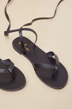 From mini skirts to lil' shorts, the Lulus Maire Black Lace-Up Flat Thong Sandals are ready to complete every summer OOTD! These trendy sandals have a smooth, faux leather construction that shapes an almond-shaped footbed and a thong upper with slender straps. Long laces sprout from the sides to lace up and secure above the ankle. 0. 5" rubber heel. Smooth insole. Rubber sole has nonskid markings. Man made materials. Imported. Lulus | Maire Black Lace-Up Flat Thong Sandal Heels | Size 5. Black Lace Up Flats, Spring Break Outfit, Summer Ootd, Trendy Sandals, Leather Thong Sandals, Almond Shaped, Sandal Heels, Rubber Heels, Lace Up Flat