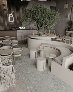 the interior of a restaurant with round tables and stools, potted trees in the background