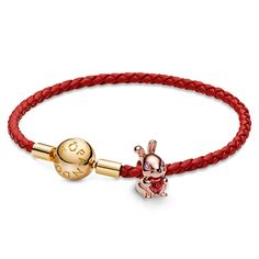 From Pandora, celebrate the year of your birth and new beginnings with the Chinese Year of The Rabbit Charm and Red Woven Leather Bracelet Set. This 14k rose gold-plated 3D rabbit holds a heart-shaped red man-made crystal and shines a bright light into the new year that embodies peace, elegance and a dash of luck. Wear this set to mark your special occasion or gift it to someone born under the rabbit sign. Rabbit Sign, 3d Rabbit, Rabbit Charm, Wedding Day Jewelry, Chinese Year, Year Of The Rabbit, Engagement Ring Guide, Metal Shop, The Rabbit