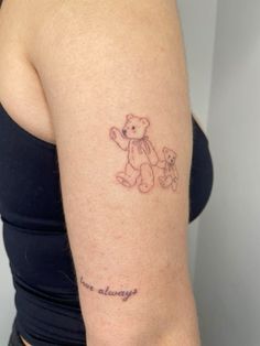 a woman with a tattoo on her arm that says i'm always and a teddy bear