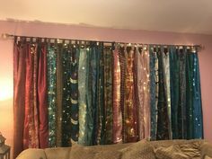 a living room filled with lots of different colored curtains