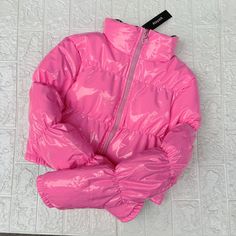 Pink Nylon Puffer Jacket For Spring, Pink Nylon Puffer Outerwear, Casual Pink Nylon Puffer Jacket, Pink Nylon Outerwear With Zipper Closure, Pink Nylon Puffer Jacket For Fall, Trendy Solid Nylon Outerwear, Trendy Pink Hooded Puffer Jacket, Pink Nylon Outerwear For Fall, Fitted Outerwear For Cold Weather