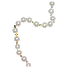 The classic white pearl necklace with 6mm pearls, sparkling multicolor sapphires and other gemstones! Colors follow the pattern of the rainbow, hand knotted on multicolor silk thread, finished with an 14k solid gold clasp. • Highest quality pearls • Perfect round and shiny luster • hand carved sparkling pink sapphires • hand carved sparkling tourmalines • hand carved sparkling tanzanite • hand carved sparkling sky blue Apatite • 14K solid gold clasp • Hand knotted on multicolor silk that follow Elegant Multicolor Single Strand Gemstones, Elegant Multicolor Pearl Necklace With Gemstone, Elegant Multicolor Gemstone Beads Pearl Necklace, Elegant Rainbow Beaded Jewelry, Rainbow Sapphires, Bracelet Love, White Pearl Necklace, Blue Apatite, John Galliano