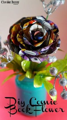 a close up of a flower in a vase on a pink background with the words, big comic book flower