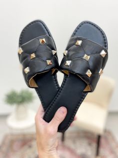 Make a statement and get ready to turn heads wearing these Feeling Bold Studded Slides Black! Boast your boldness with the perfect mix of bling and comfort: gold stud details for a touch of elegance, a quilted strap for added support, and slip on slides for easy-breezy wear. Perfect to rock it out in style! True to size Luxury Closed Toe Slides With Cushioned Footbed, Elegant Luxury Slides With Buckle Closure, Luxury Cushioned Slides, Easy Breezy, Black 7, Gold Studs, Slides, Slip On, Turn Ons