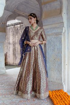 This is a beautiful 3 piece set.The set consists of foil print and mirror detailing blouse has v neck, regular sleeves, tie up style in the back teamed with flared embroidered lehenga with 7 meters ghera and an organza dupatta with mirror detailing. 3 Piece Set Fabric - Brocade Kurti Length-1.5 meter blouse Lehenga Length-44 inches Work- Foil Print and Mirror Detailing Color-Blue Model Size- 5.8 tall wearing small size Sleeves - Regular Sleeves Neck-V neck Washing Care-Hand wash or Dry Clean