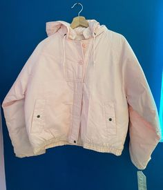 Vintage 1980's pink puffy coat made by Vanderbilt International Collection. Removable hood. Front zip and button closure. Adjustable snap cuffs. Inside and outside pockets. Drawstring hood.  Unworn deadstock with original tags. Some spotting at bottom elastic hem due to ageing, otherwise great condition! See photos. Winter Parka For Cold Weather In Pink, Pink Puffer Jacket With Detachable Hood For Cold Weather, Pink Hooded Puffer Jacket For Streetwear, Pink Hooded Puffer Jacket For Spring, Pink Outerwear With Drawstring Hood For Cold Weather, Pink Drawstring Hood Outerwear For Cold Weather, Pink Puffer Jacket With Pockets For Winter, Pink Winter Puffer Jacket With Pockets, Hooded Puffer Windbreaker For Spring