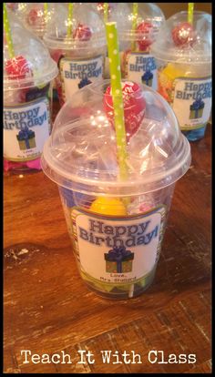 plastic cups filled with happy birthday candy and straws