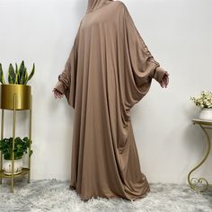 Description Details: Fabric: Polyester Pattern: Solid Color Occasion: Casual/Festival Season: Spring/Fall Fitness: Regular Sleeve Type:Bat Sleeves Sleeve Length: Long Sleeve Size Unit: CM Size Chart OneSize Length(CM) 135 Solid Color Long Maxi Dress For Eid, Brown Long Sleeve Kaftan For Fall, Long Brown Dress For Eid, Long Brown Dresses For Eid, Brown Long Dress For Eid, Modest Long Brown Maxi Dress, Brown Long Thobe For Eid, Bohemian Style Long Brown Thobe, Modest Long Sleeve Brown Maxi Dress