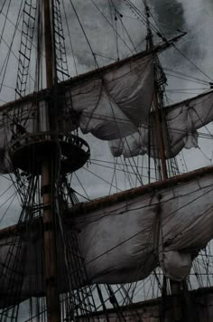 an old sailing ship with sails and masts