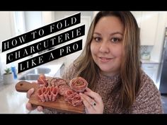 a woman holding a cutting board with raw meats on it and the words how to fold charcuterie like a pro