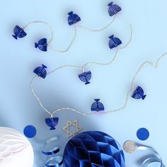 blue and white decorations on a light blue background