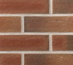 a brick wall that has been made from red bricks