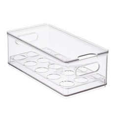 a clear plastic container with six compartments on the bottom and one section in the middle