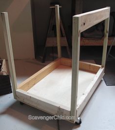 an unfinished bed frame sitting on top of a table