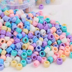 many different colored beads are scattered on the table