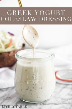 greek yogurt coleslaw dressing being poured into a jar