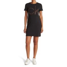 A Stylish Embellished Logo T-Shirt Dress Is A Glam Yet Laid Back Addition To Your Wardrobe! 34" Length (Size S); Crew Neck; Short Sleeves; Chest Rhinestone Embellished Logo Design; Solid; 95% Cotton, 5% Spandex; Machine Wash, Tumble Dry. Imported. Size: Large Fitted Short Sleeve Calvin Klein T-shirt, Fitted Calvin Klein Short Sleeve T-shirt, Casual Crew Neck Sequin Dress, Long Sleeve Satin Dress, Maternity Sweater Dress, Grey Knit Dress, Wrap Sweater Dress, Long Sleeve Ruffle Dress, All Black Dresses