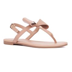 From the beach to the boardwalk, the Abril sandal is a quintessential summer essential. Its minimalistic design, adorned with a charming bow detail, adds a touch of femininity to any outfit. Perfect for warm weather, this versatile sandal effortlessly enhances your summer style, making it a must-have for your seasonal wardrobe. Nude Sandals Flat, Casual Summer Flip Flops With Bow, Open Toe Sandals With Bow For Vacation, Adjustable Bow Sandals For Beach, Beach Open Toe Sandals With Bow, Chic Adjustable Jelly Sandals For Summer, Adjustable Strap Jelly Sandals For Summer, Beach Sandals With Bow In Synthetic Material, Beach Sandals With Bow