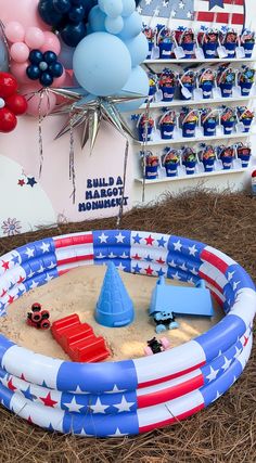 an inflatable swimming pool with balloons and decorations